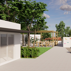 Área externa da clínica com jardim e passarela coberta.